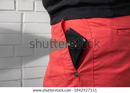 Smart phone in pocket taking unauthorized video.