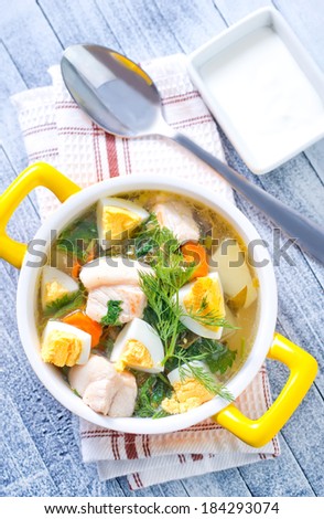 green soup with boiled eggs