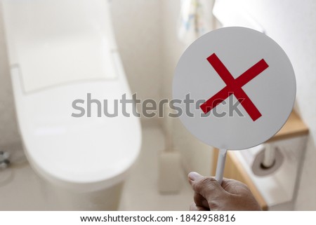 Western style toilet and false sign