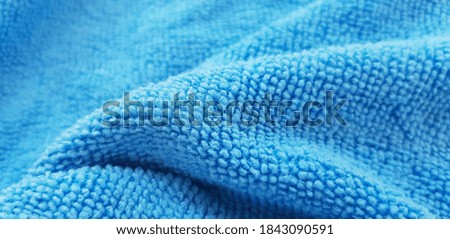 Light blue micro fibre in folds (texture).
 Royalty-Free Stock Photo #1843090591
