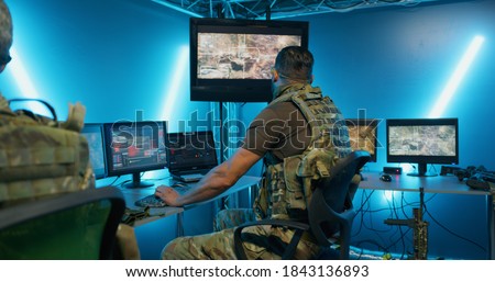Military men working on computer systems while hiding in secret base of intelligence Royalty-Free Stock Photo #1843136893