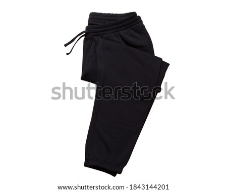 Black  Sport Sweatpants Isolated on White Background. Folded black pants Royalty-Free Stock Photo #1843144201