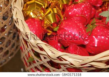 Alms flowers (Ribbon flowers), Alms flowers in basket. For giving alms to make merit in Buddhism religious traditional in Thailand.