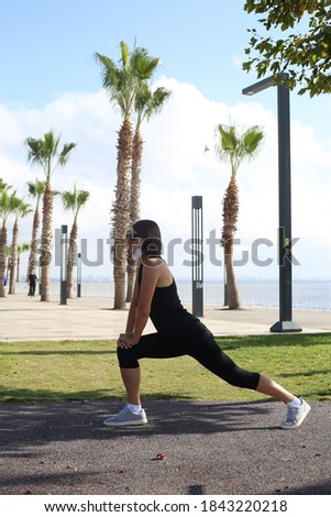 Young sportive woman making stretching outdoor in the morning in Antalya Turkey.