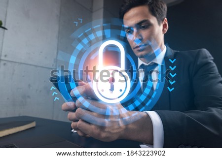 Man in office working with Smartphone, Searching for new technology to protect business information. Lock hologram, typing phone. Double exposure.