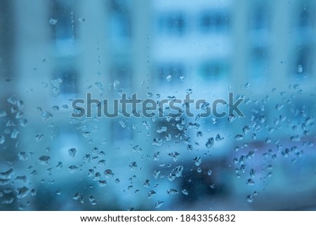 Rain Drops On Glass With City Background. Water drops texture