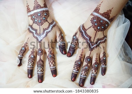 beautiful henna in the hands of the bride