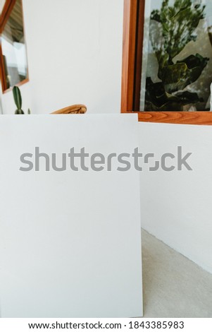 Blank white poster sign photo frame.
