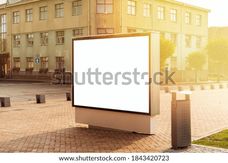 Large blank billboard on a street, banner with room to add your own text