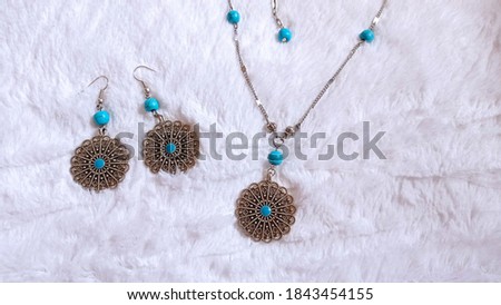 Photo of jewelry set handmade necklace and Earrings. Picture of texture with white background.