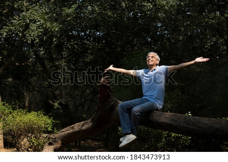 Portrait of a smiling senior man in Nature Royalty-Free Stock Photo #1843473913