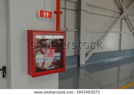 Fire Hose cabinet in the building and light signal.