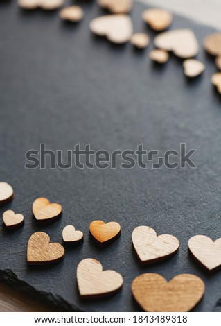 Wooden hearts in retro style as concept of love. Place for text.