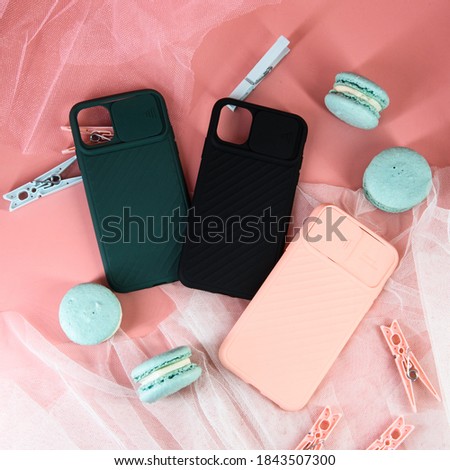 three colorful mobile phone cases