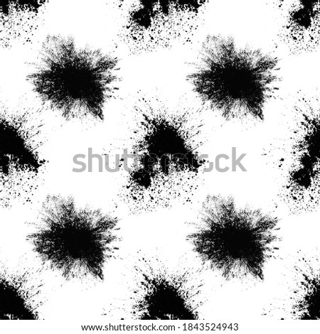 seamless pattern of black spots with splashes isolated on white background