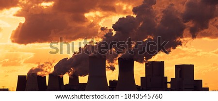 Emissions and Global Warming - A panoramic image of a coal-fired power plant Royalty-Free Stock Photo #1843545760