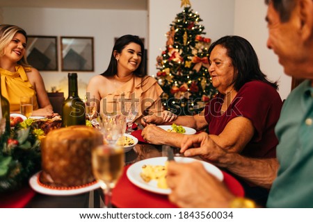 Brazilian Christmas. Family celebrating Christmas at home Royalty-Free Stock Photo #1843560034