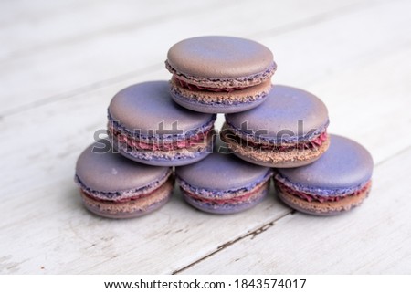 Blueberry macaroons, purple macaroons on light color background