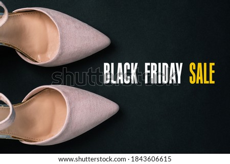 Beige shoes on a black background with a copy of the space. Womens shoes close-up. Womens blog. Flat layout.