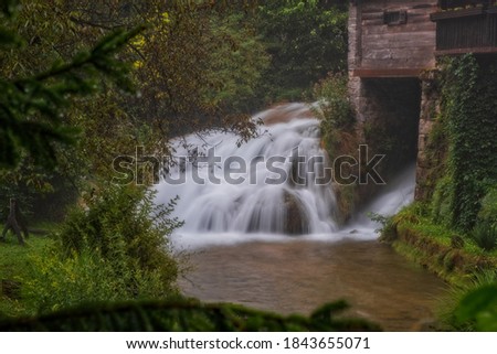 Waterfall on Korana river canyon in village of Rastoke. Slunj in Croatia. Near Plitvice Lakes National Park. August 2020, long exposure picture.