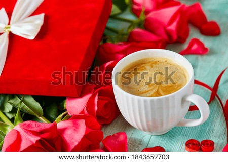 cup of coffee and hearts on light surface