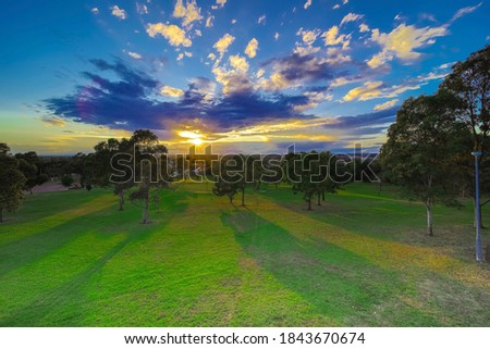 Sunset in a Suburban Sydney park looking down at the surrounding suburbs