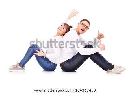 A picture of a young couple showing ok signs over white background