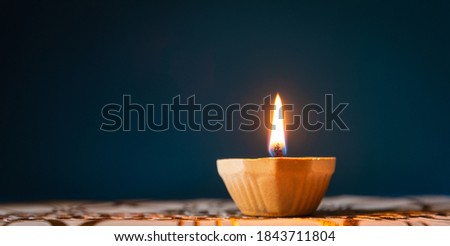 Happy Diwali - Clay Diya lamps lit during Dipavali, Hindu festival of lights celebration Royalty-Free Stock Photo #1843711804