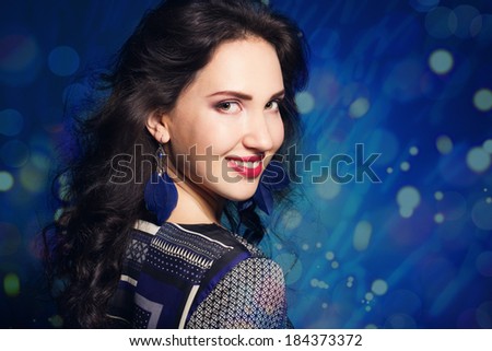 Brunette lady with feather earring