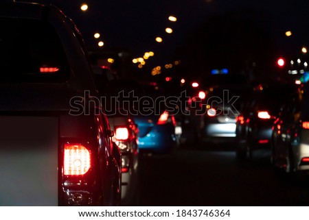 Blurred of cars on the road heading towards the goal of the trip, Urgent traffic in the night. Royalty-Free Stock Photo #1843746364