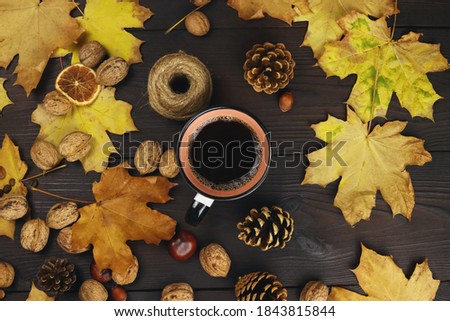 Autumn composition of yellow leaves, coffee on the background of a wooden table. Flat Lay