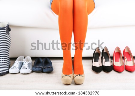 Perfect woman legs and different shoes, close up