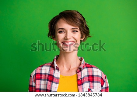 Close up photo of delighted young person smile look camera wear plaid isolated on green color background
