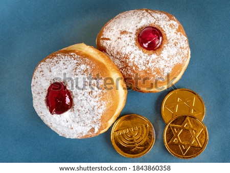 Fresh donuts and  chocolate coins for Hanukkah celebration.  