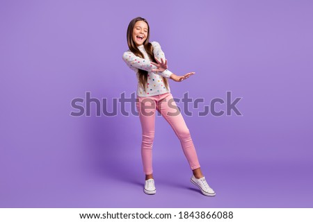 Full length body size photo of dancing singing small girl wearing casual clothes isolated on bright violet color background Royalty-Free Stock Photo #1843866088