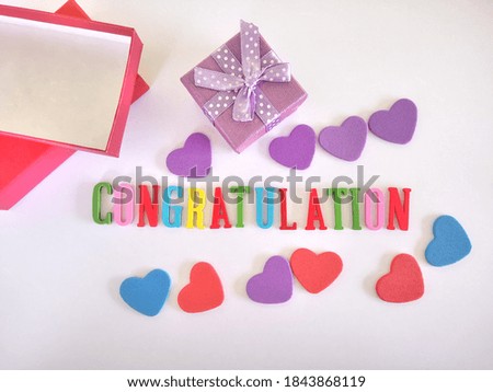 CONGRATULATION text concept with heart signs