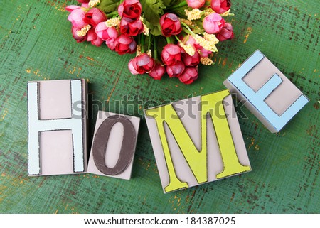 Composition with decorative letters on wooden background