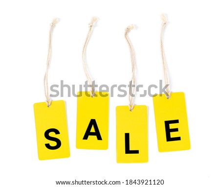 Yellow label tags with inscription sale at white background.