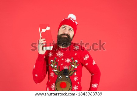 santa claus bearded guy wish happy new year and merry christmas holiday ready to celebrate party with xmas presents and gifts, black friday shopping.