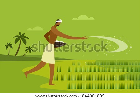 An Indian farmer spreading fertiliser in the paddy field Royalty-Free Stock Photo #1844001805