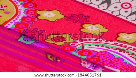 Silk fabric. Red tone. Paisley. Bohemian traditional elements of indian paisley theme with ethnic details in bohemian print, colorful texture, background, pattern