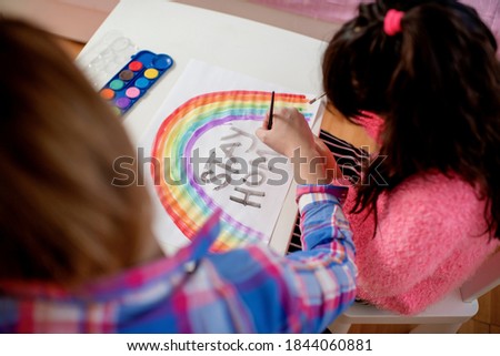 Young mother and daughter having fun time at home