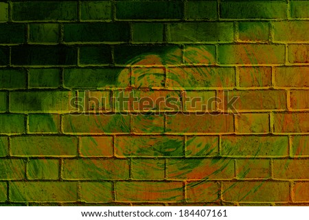 Colorful abstract graffiti on a brick wall with rings.