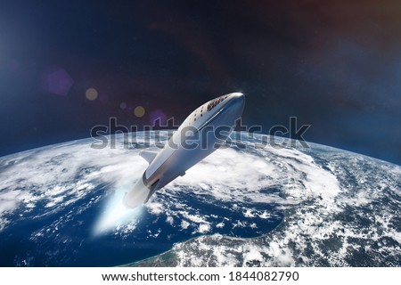 Starship in low-Earth orbit. Elements of this image furnished by NASA. Royalty-Free Stock Photo #1844082790