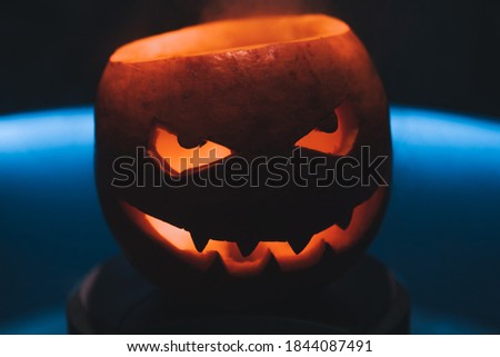 Halloween. All Saints' Day. Pumpkin - Jack lantern in the fog