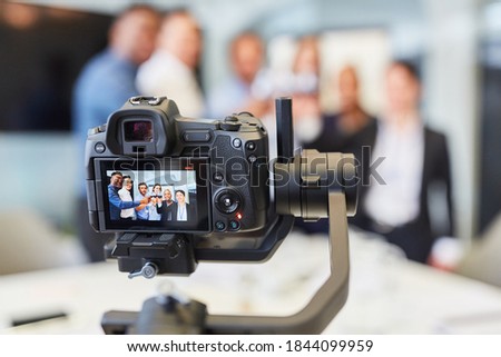 Video camera recording a company party for live streaming online