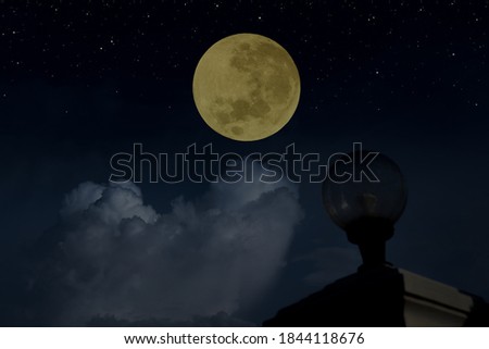 Full moon and stars in the dark night with lamp.