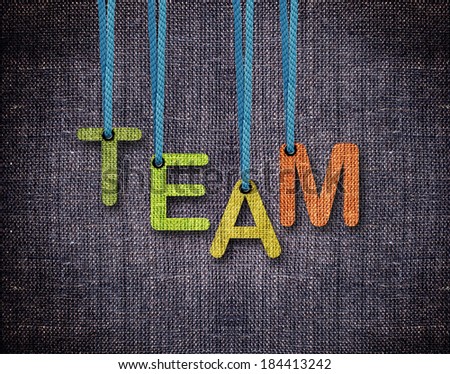 Team Letters hanging strings with blue sackcloth background.