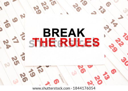 text BREAK THE RULES on a sheet from Notepad.a digital background. business concept . business and Finance.