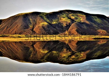 Beautiful picture with reflection, from Iceland. All the different colors come from the volcanic reactions in Iceland